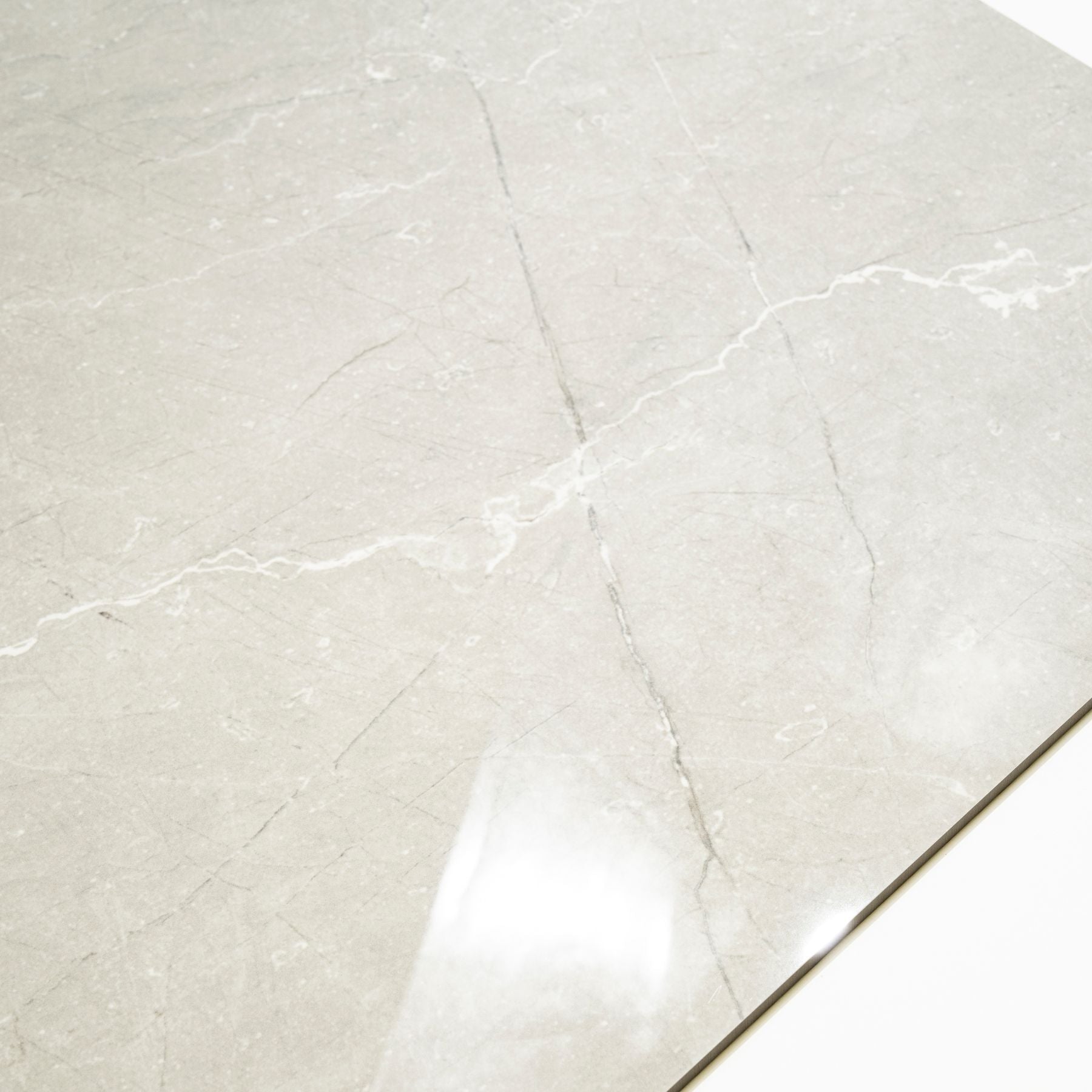 Toscana Grey glossy marble effect porcelain tile 60x120cm with 9mm thickness features soft grey tones, natural veining and polished finish.