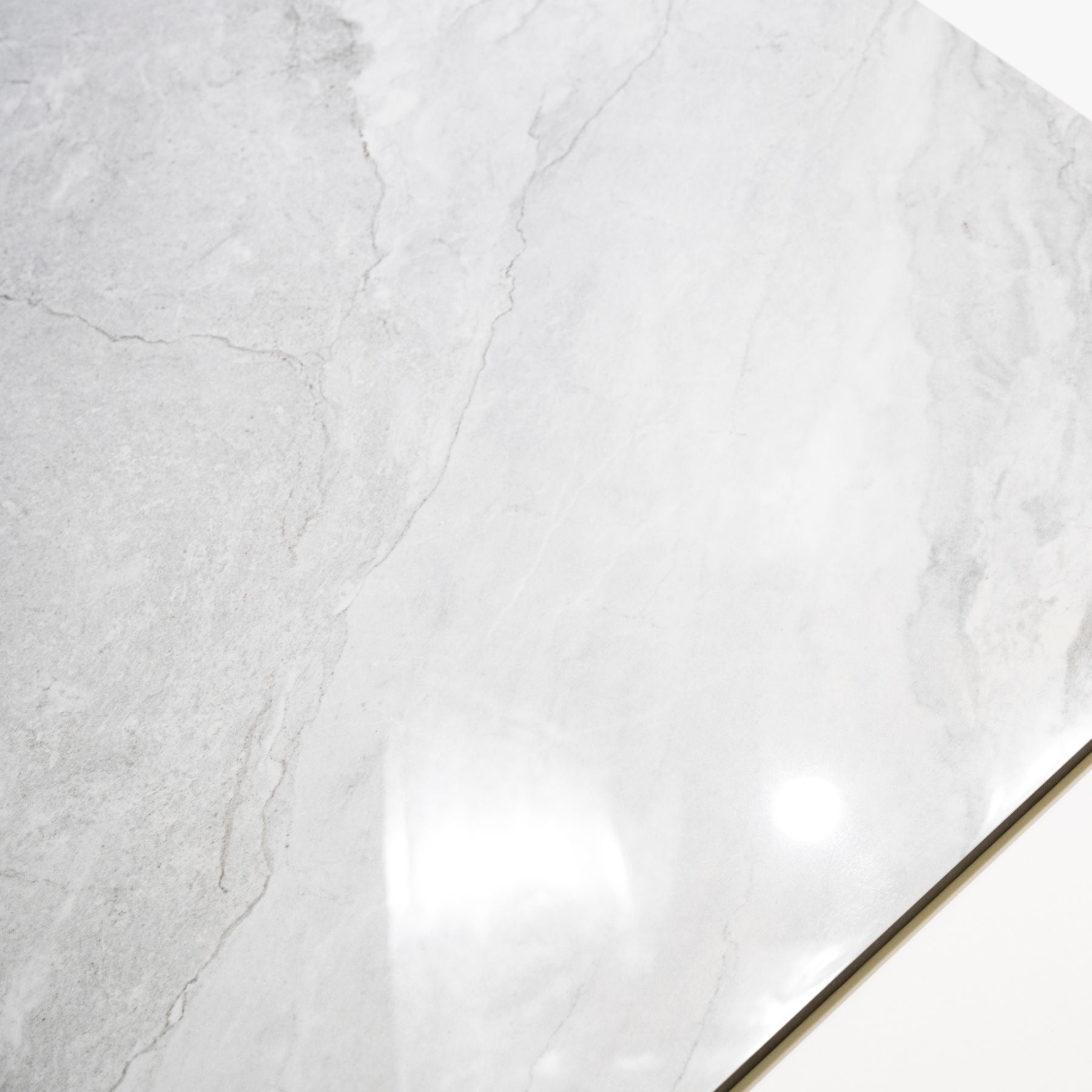 Wazti White glossy marble effect porcelain tile 60x120cm with 9mm thickness features bright white base, subtle veining and polished finish.
